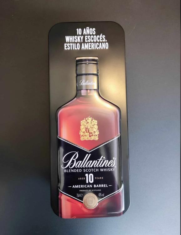 Embossed metal collector tin with bottle cradle